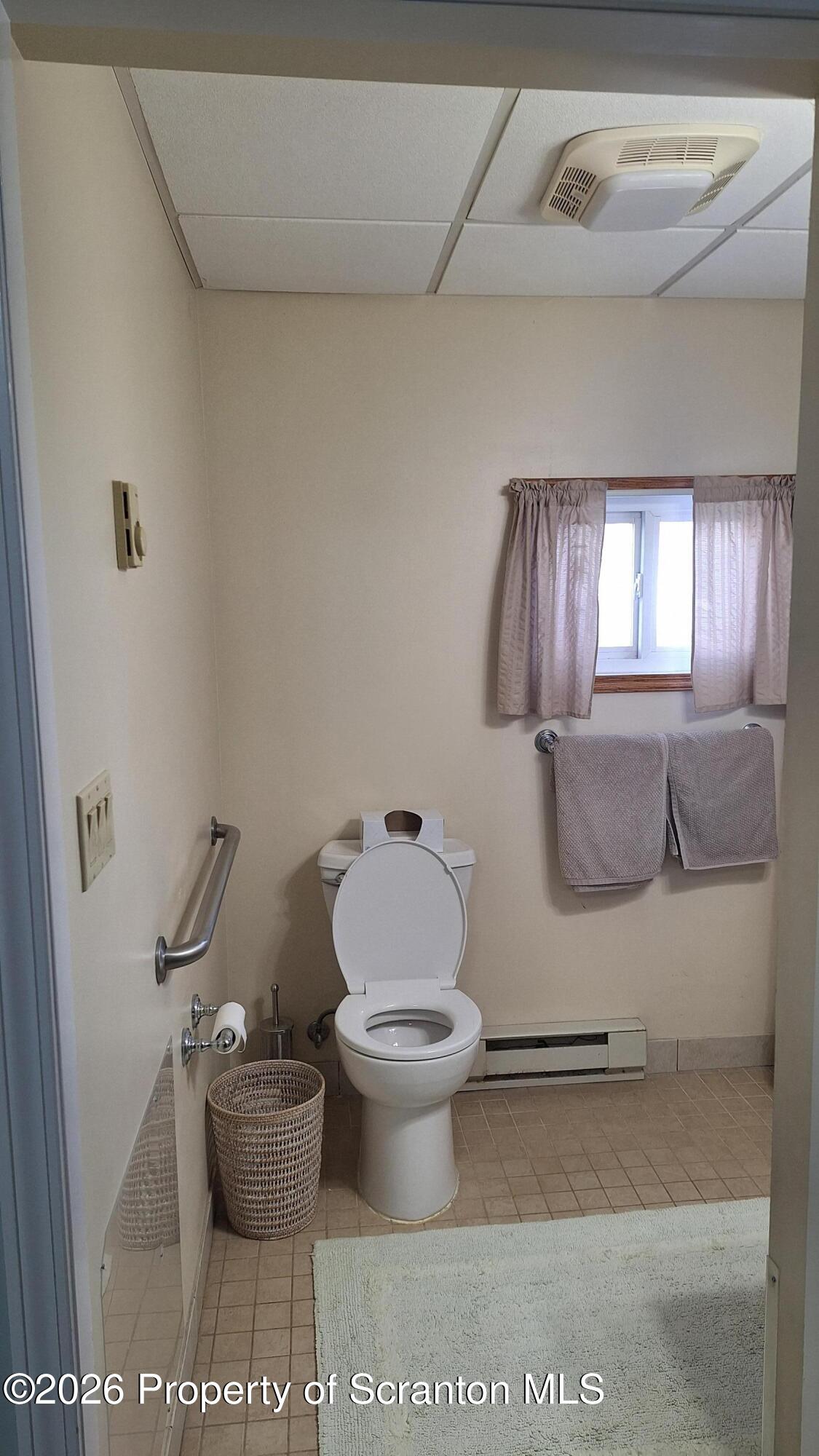 1947 Myrtle Street Scranton, PA 18510 - Photo 16 of 33 a bathroom with a toilet and a mirror