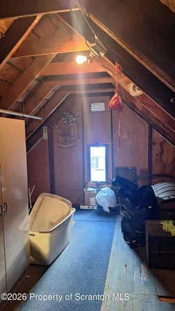 a view of a hall with wooden floor