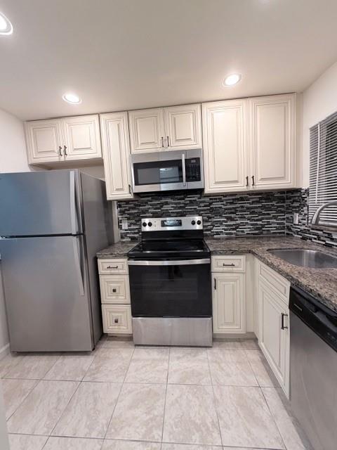 9949 Sandalfoot Boulevard, Unit 542 Boca Raton, FL 33428 - Photo 1 of 9 a kitchen with cabinets stainless steel appliances and a counter space