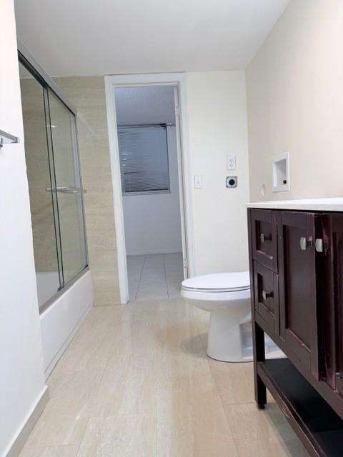 9949 Sandalfoot Boulevard, Unit 542 Boca Raton, FL 33428 - Photo 8 of 9 a view of a hallway to rooms