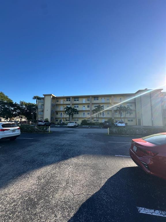 9949 Sandalfoot Boulevard, Unit 542 Boca Raton, FL 33428 - Photo 9 of 9 a view of outdoor space and deck