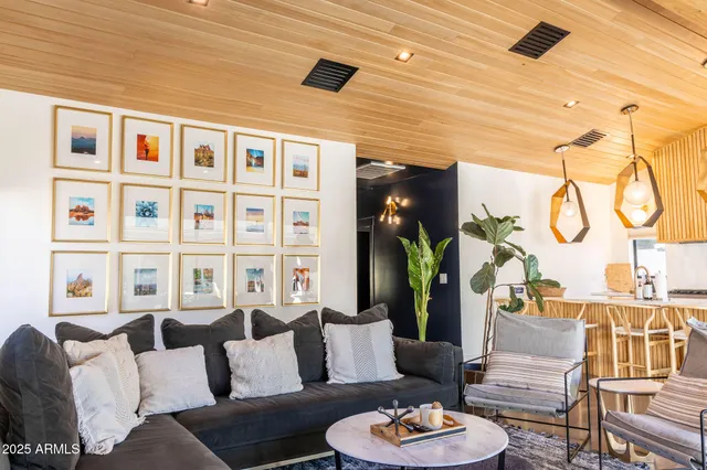 a living room with furniture and a table