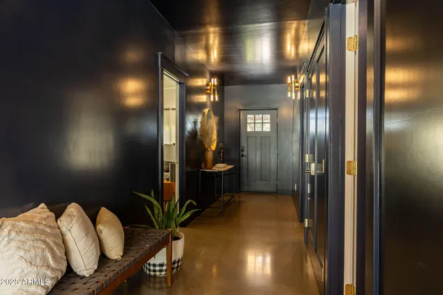 a bathroom with shower and mirror