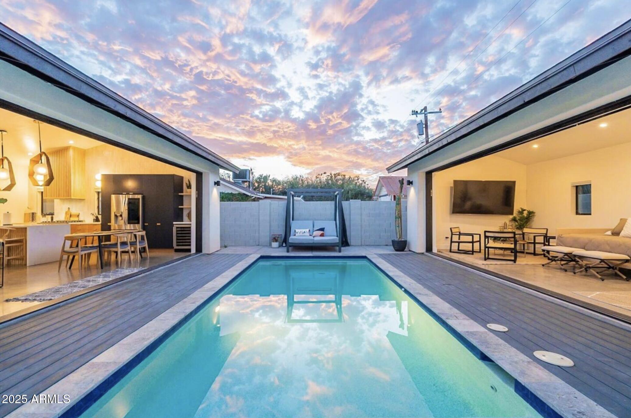 68 West Lewis Avenue Phoenix, AZ 85003 - Photo 2 of 42 a swimming pool with chairs and wooden floor