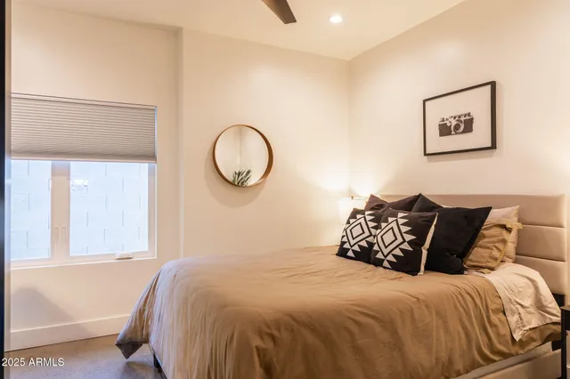 a bedroom with a bed and window