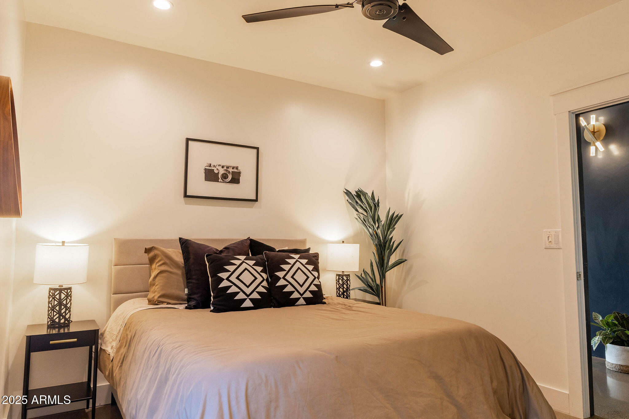68 West Lewis Avenue Phoenix, AZ 85003 - Photo 25 of 42 a bedroom with a bed and a painting on the wall