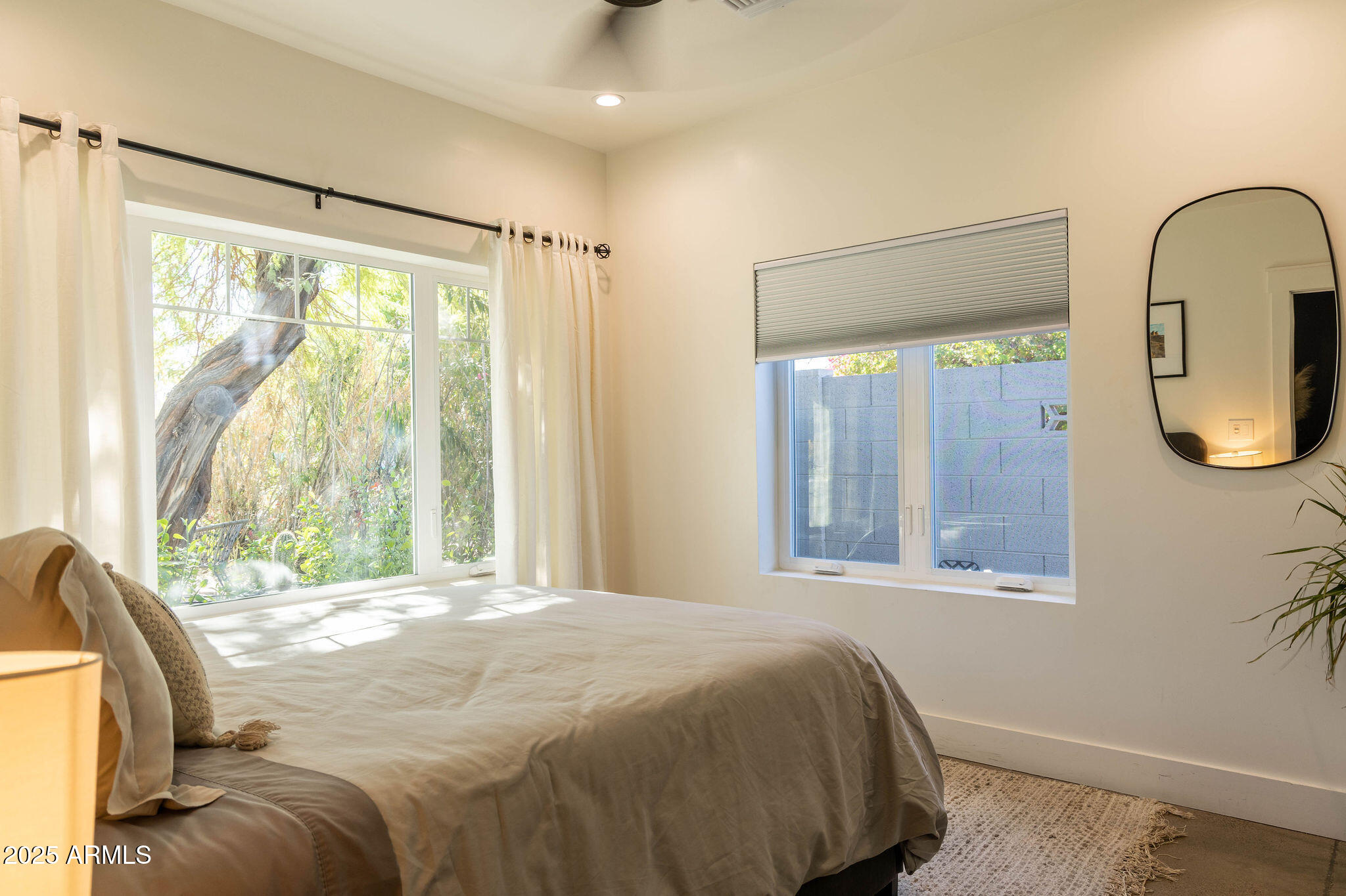 68 West Lewis Avenue Phoenix, AZ 85003 - Photo 26 of 42 a bedroom with a bed and a large window with outer view