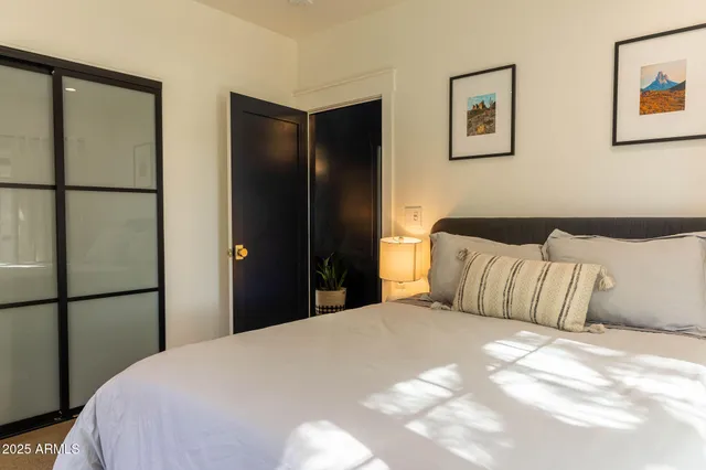 a bedroom with a bed and a window