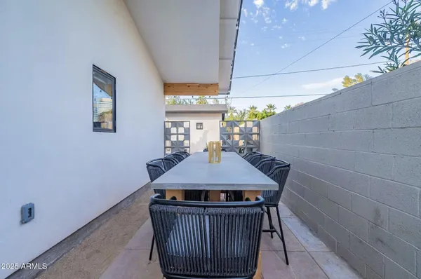 a view of a dining room with furniture and a window