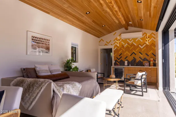 a bathroom with a granite countertop toilet sink and mirror