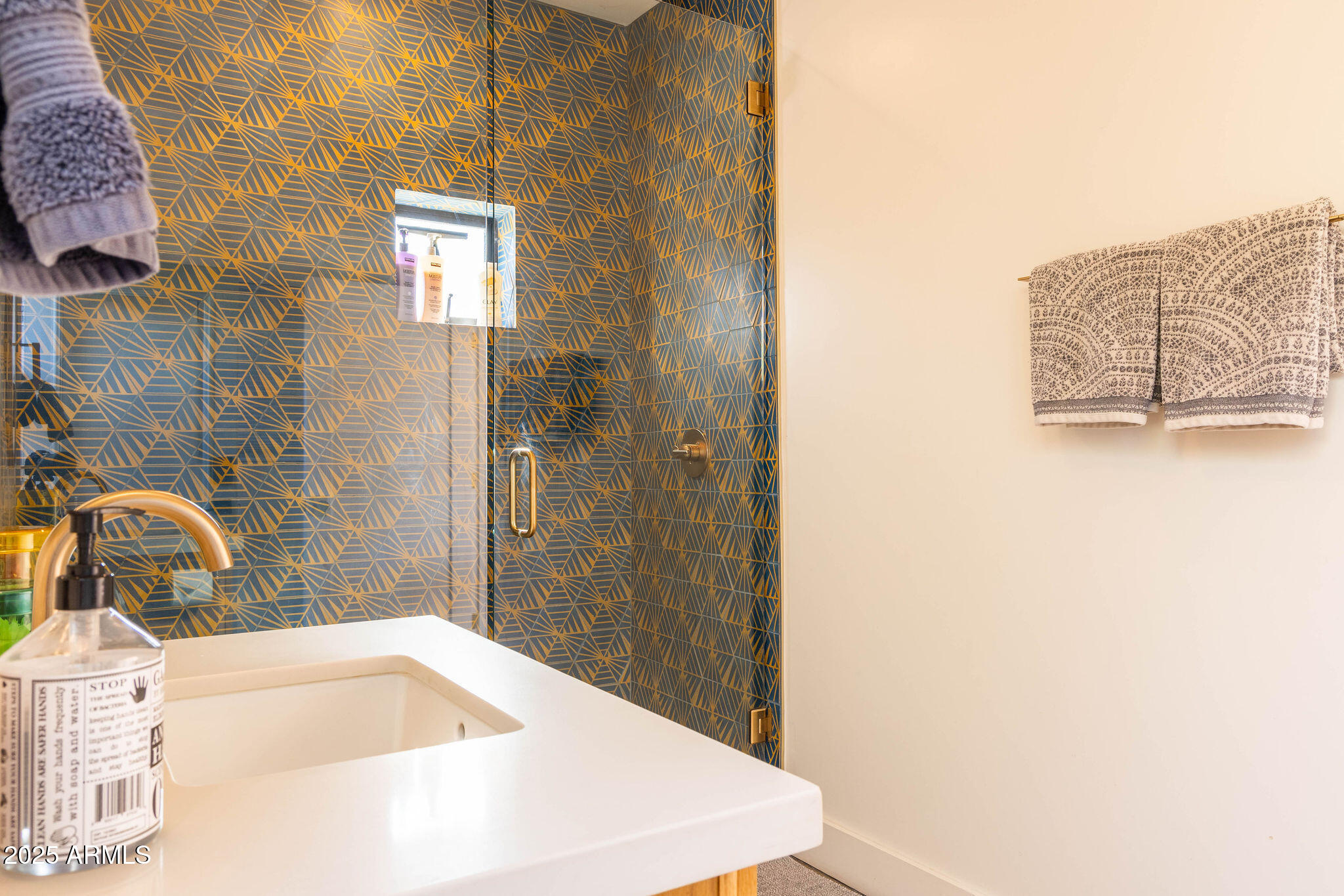 68 West Lewis Avenue Phoenix, AZ 85003 - Photo 40 of 42 a bathroom with a sink and a shower