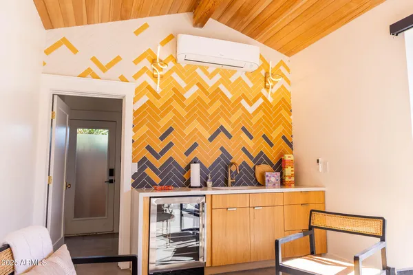 a view of a chairs and table in th patio