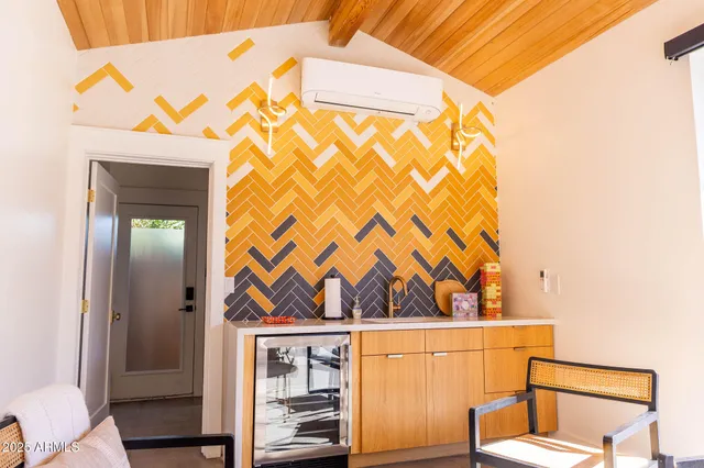 a view of a chairs and table in th patio