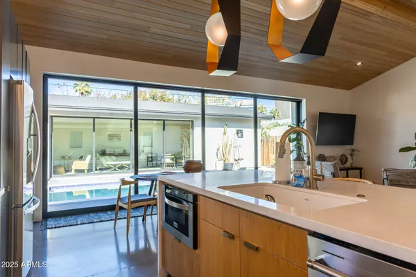 a room with sink and view of living room