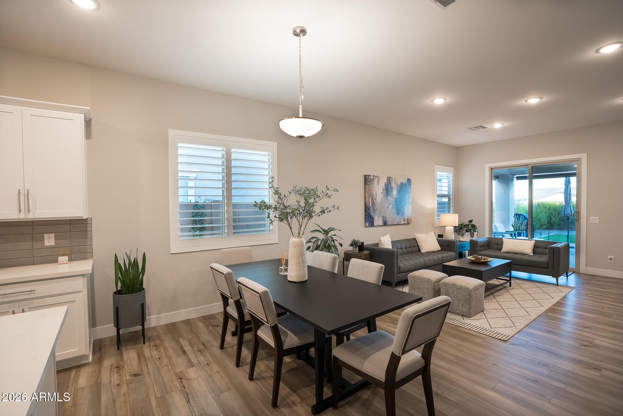 5693 206th Lane Buckeye, AZ 85396 - Photo 13 of 33 a living room with furniture a window and wooden floor