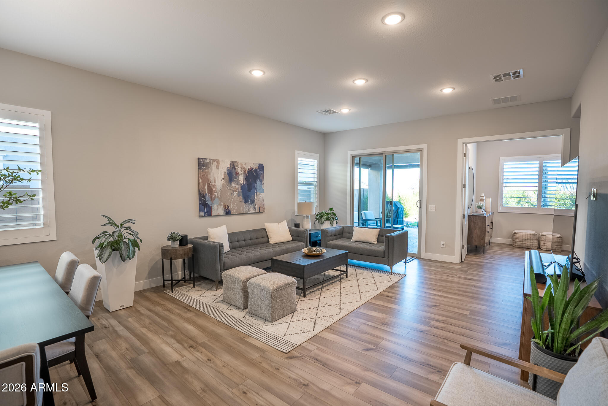 5693 206th Lane Buckeye, AZ 85396 - Photo 15 of 33 a living room with furniture or wooden floor and a large window