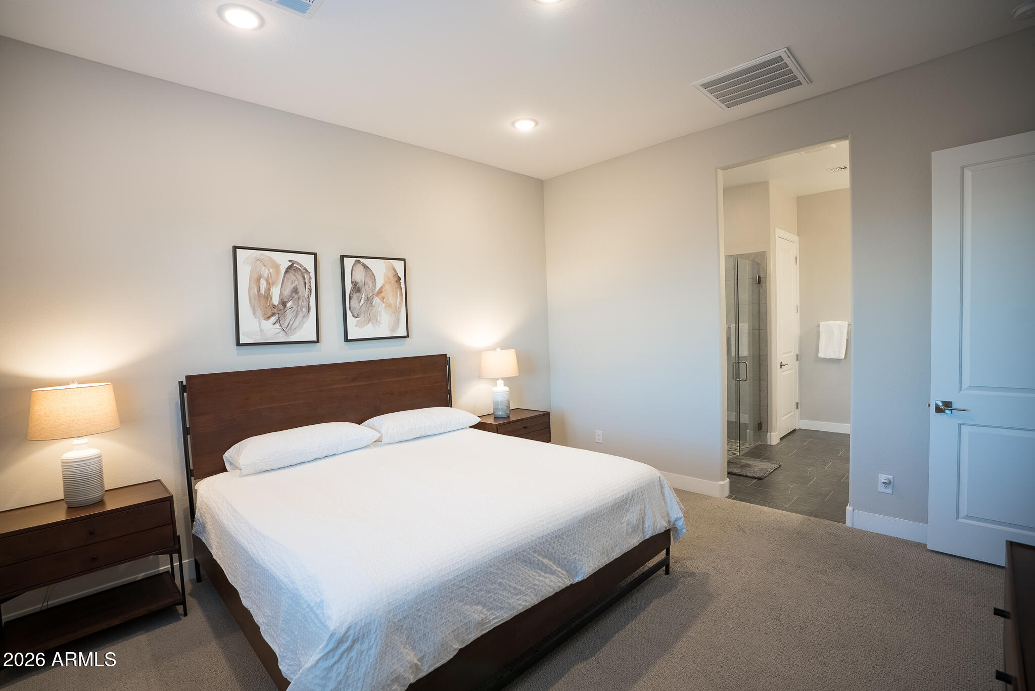 5693 206th Lane Buckeye, AZ 85396 - Photo 18 of 33 a bedroom with a bed and a lamp