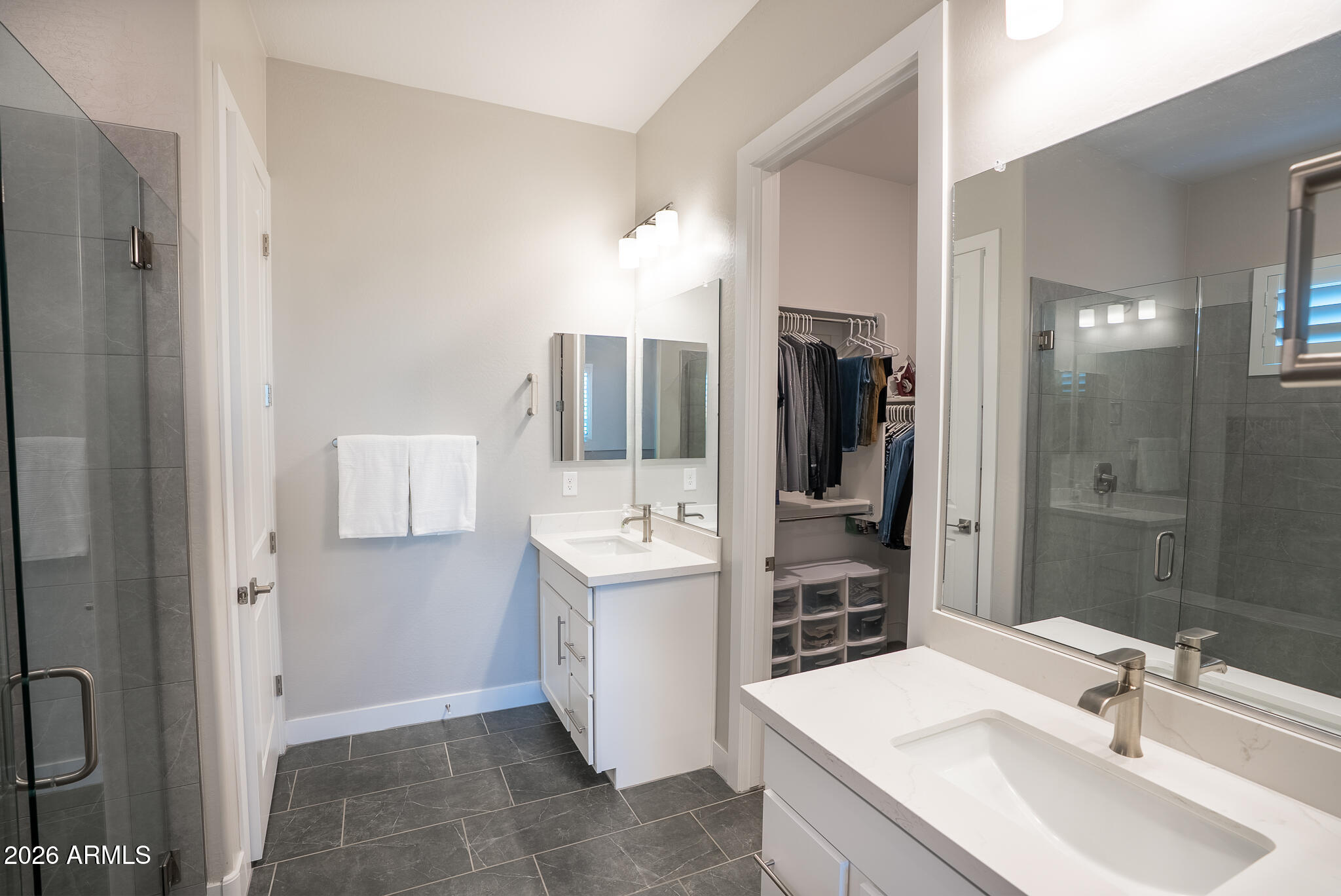 5693 206th Lane Buckeye, AZ 85396 - Photo 20 of 33 a bathroom with a sink a toilet and shower
