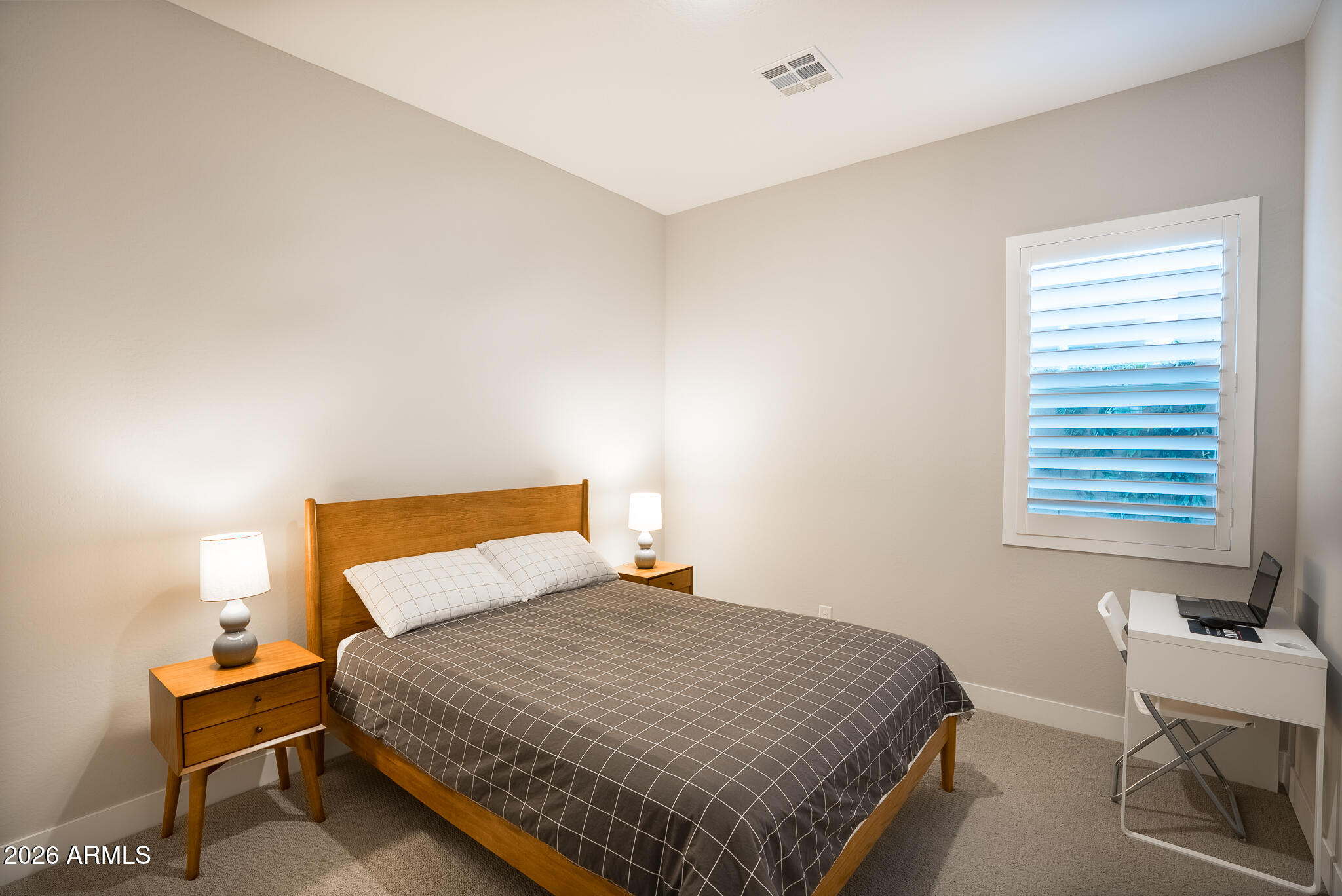 5693 206th Lane Buckeye, AZ 85396 - Photo 21 of 33 a bedroom with a bed and window