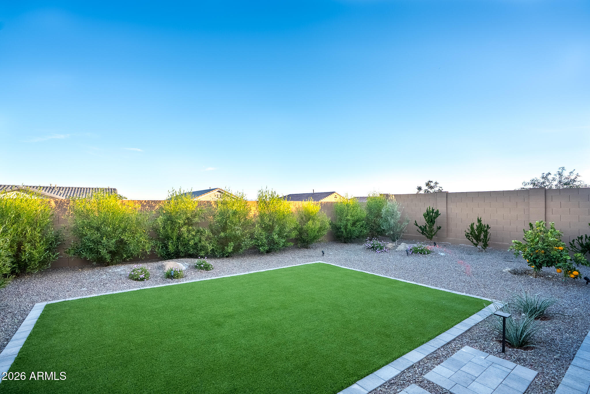 5693 206th Lane Buckeye, AZ 85396 - Photo 24 of 33 a view of a backyard with green space