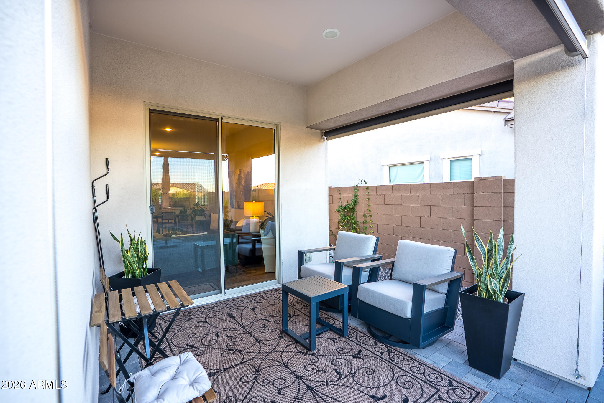 5693 206th Lane Buckeye, AZ 85396 - Photo 27 of 33 a outdoor living space with furniture and a potted plant