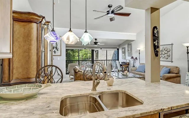 a kitchen with a refrigerator a sink and cabinets