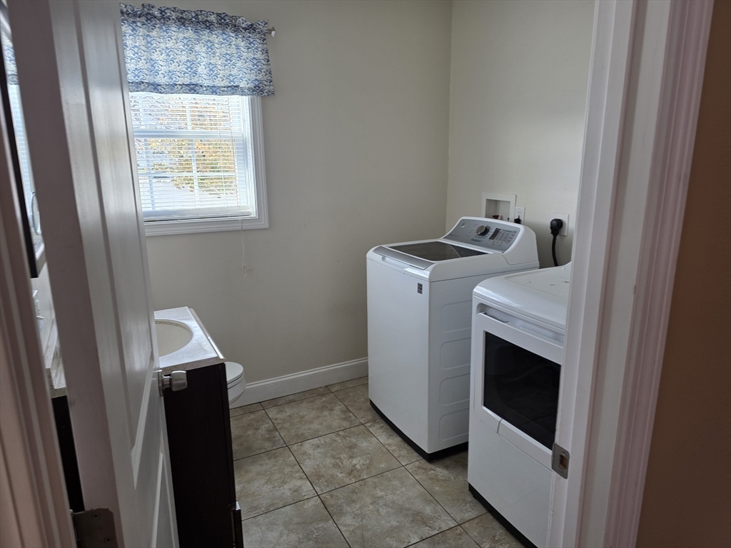 176 Oak Grove Avenue Fall River, MA 02723 - Photo 8 of 9 a utility room with dryer and washer