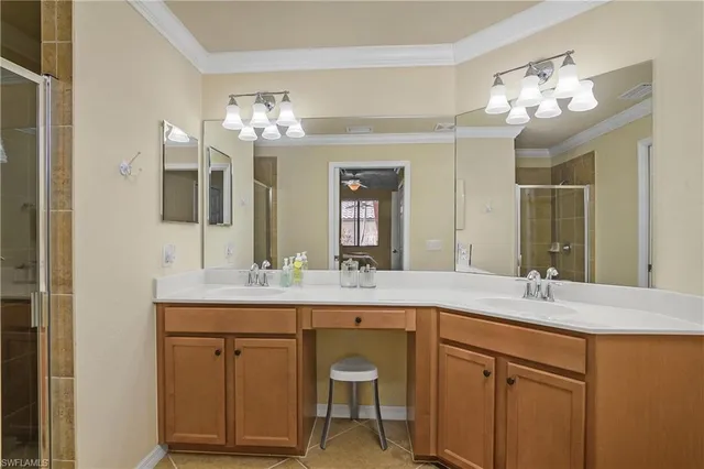 a bathroom with a double vanity sink and a mirror