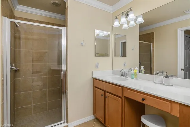a bathroom with a granite countertop sink a toilet and a mirror