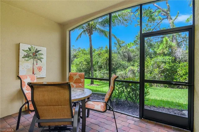a view of a city from a dining room with large windows