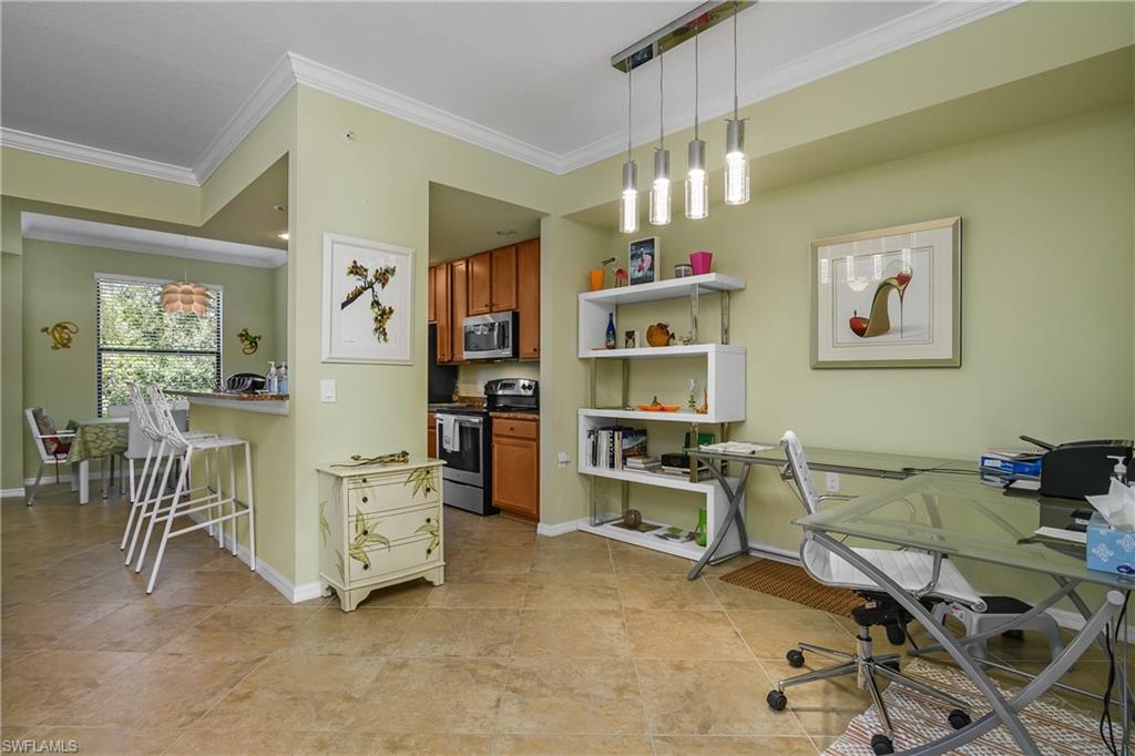 9832 Venezia Circle, Unit 1013 Naples, FL 34113 - Photo 7 of 34 a view of a workspace with furniture