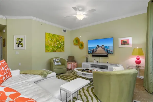 a living room with furniture and a lamp