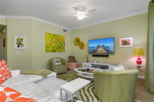 a living room with furniture and a lamp