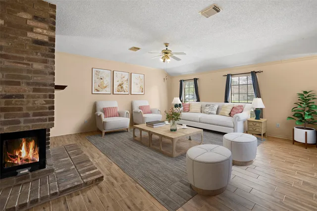 a living room with furniture and a fireplace