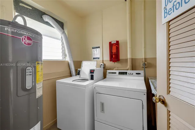a view of storage and utility room with washer and dryer
