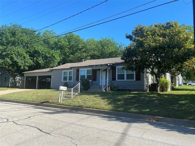 front view of a house with a yard