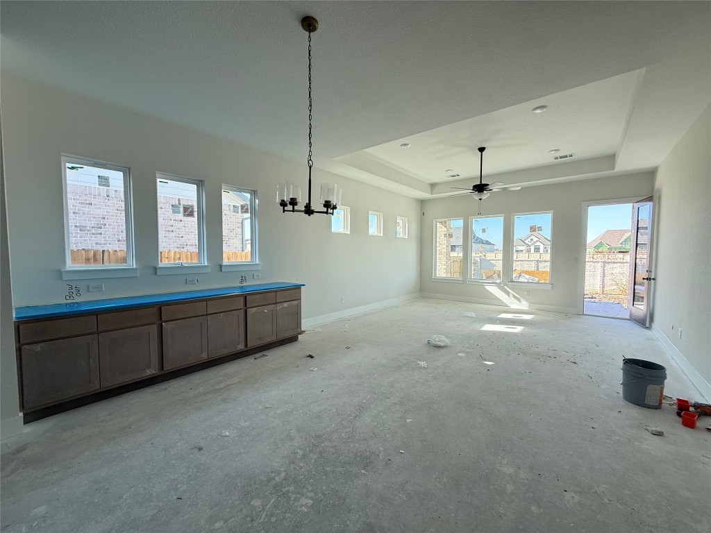 19608 Domino Champ Road Pflugerville, TX 78660 - Photo 5 of 14 a room with window and chandelier