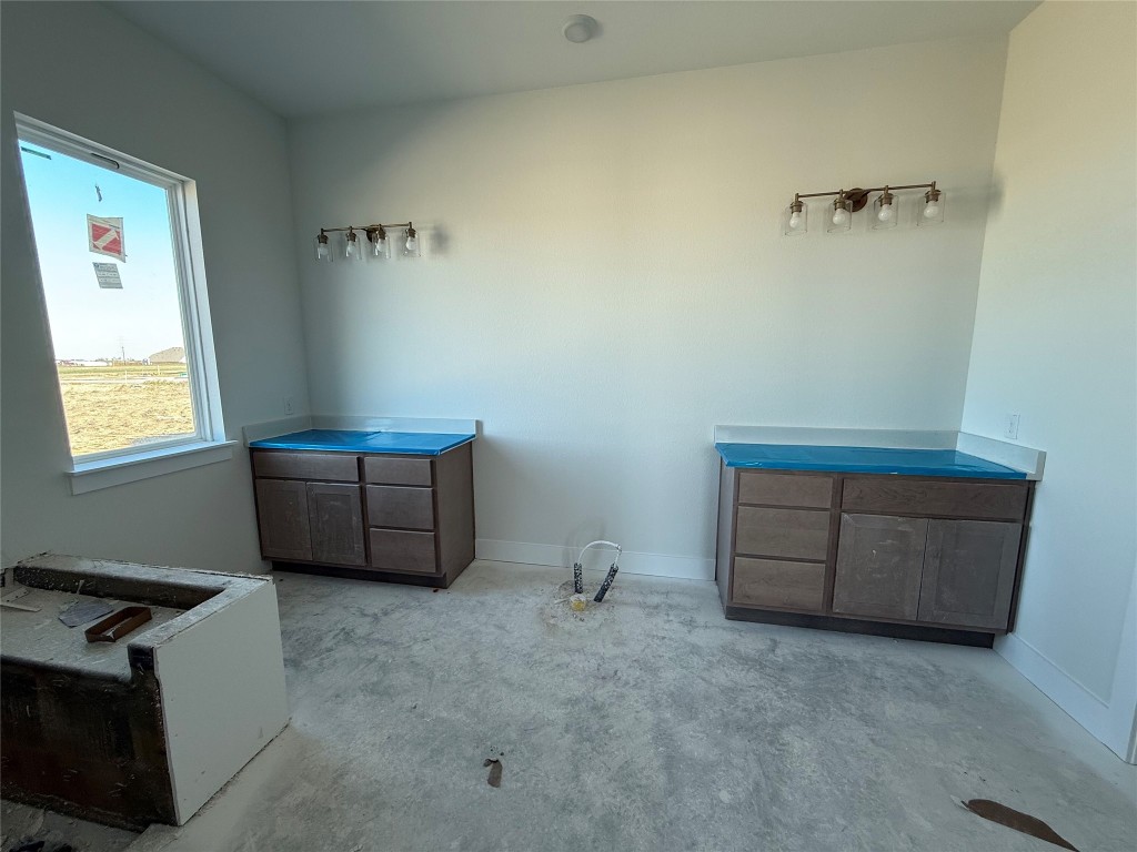 19608 Domino Champ Road Pflugerville, TX 78660 - Photo 7 of 14 a room with table and window