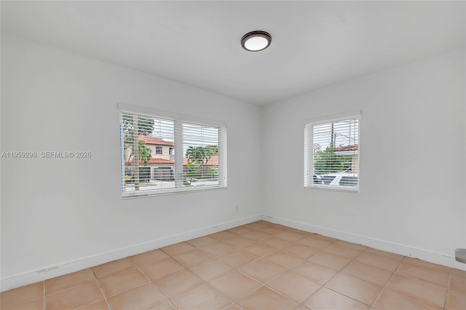 3050 Southwest 23rd Terrace Miami, FL 33145 - Photo 11 of 22 an empty room with windows