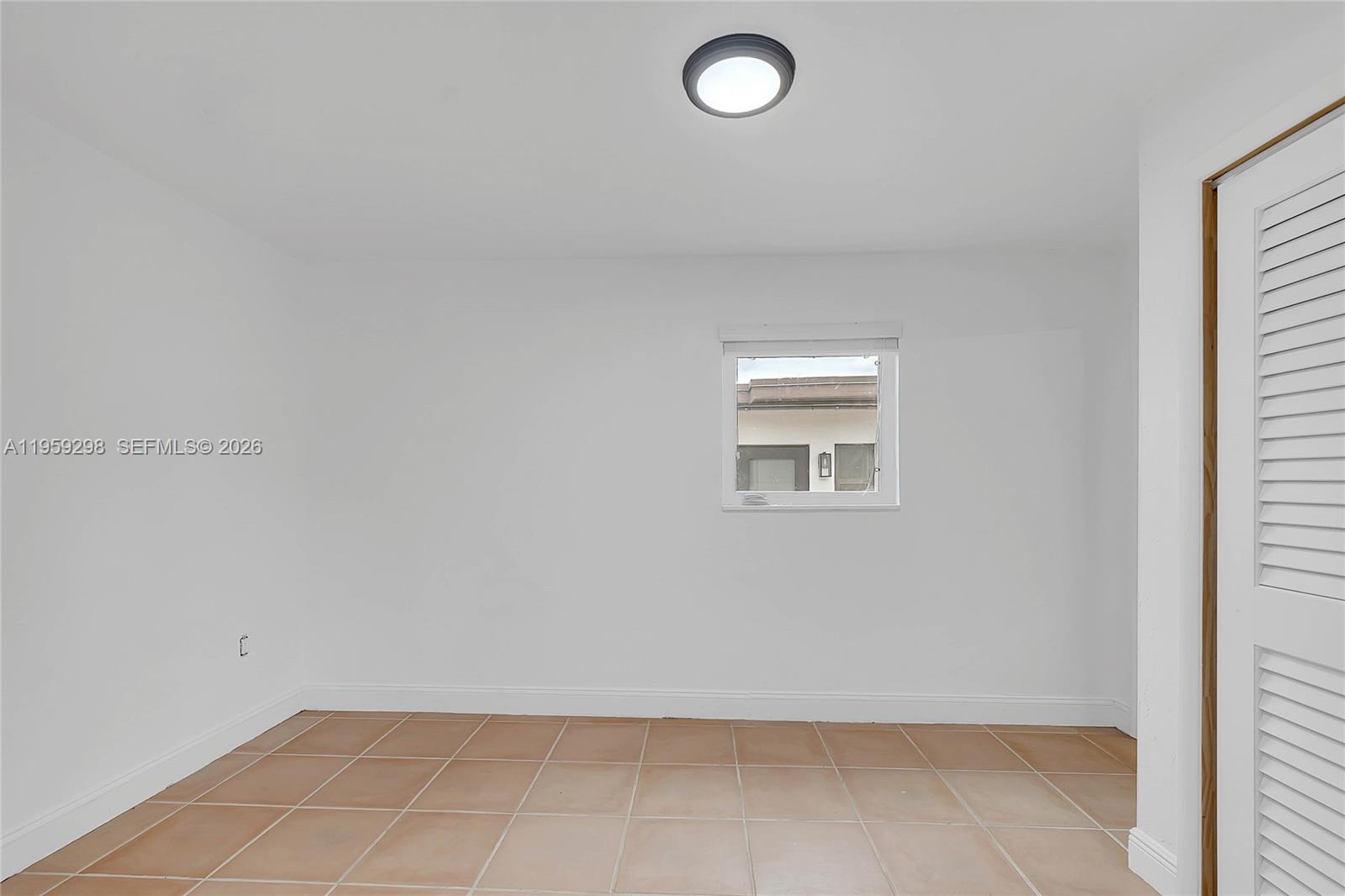 3050 Southwest 23rd Terrace Miami, FL 33145 - Photo 15 of 22 an empty room with a workbench