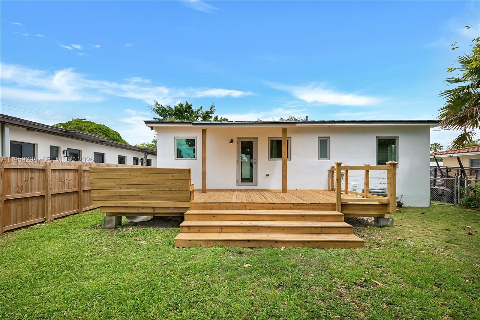 3050 Southwest 23rd Terrace Miami, FL 33145 - Photo 17 of 22 a front view of a house with a garden