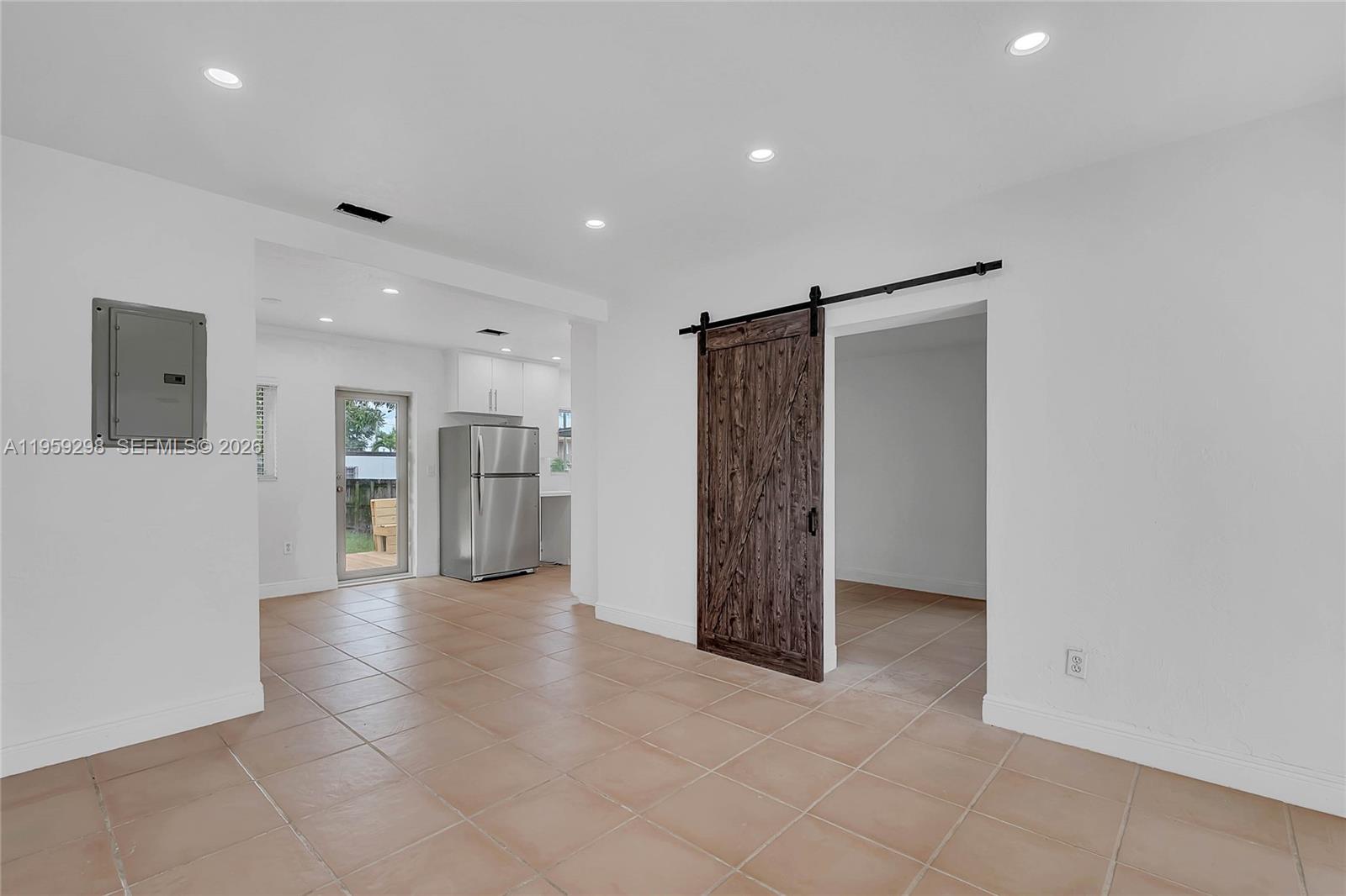 3050 Southwest 23rd Terrace Miami, FL 33145 - Photo 3 of 22 a view of a hallway with wooden cabinets