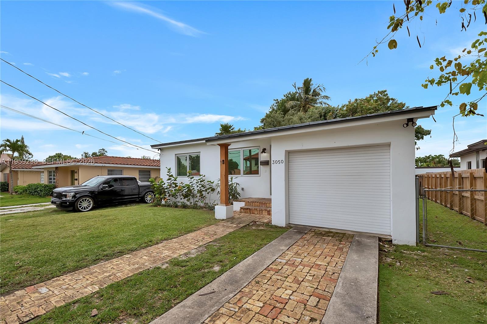 3050 Southwest 23rd Terrace Miami, FL 33145 - Photo 6 of 22 a house view with a garden space