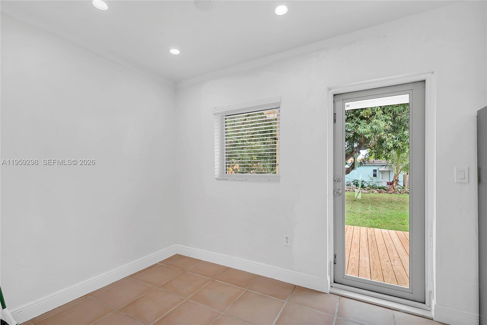 3050 Southwest 23rd Terrace Miami, FL 33145 - Photo 10 of 22 a view of an empty room with a window