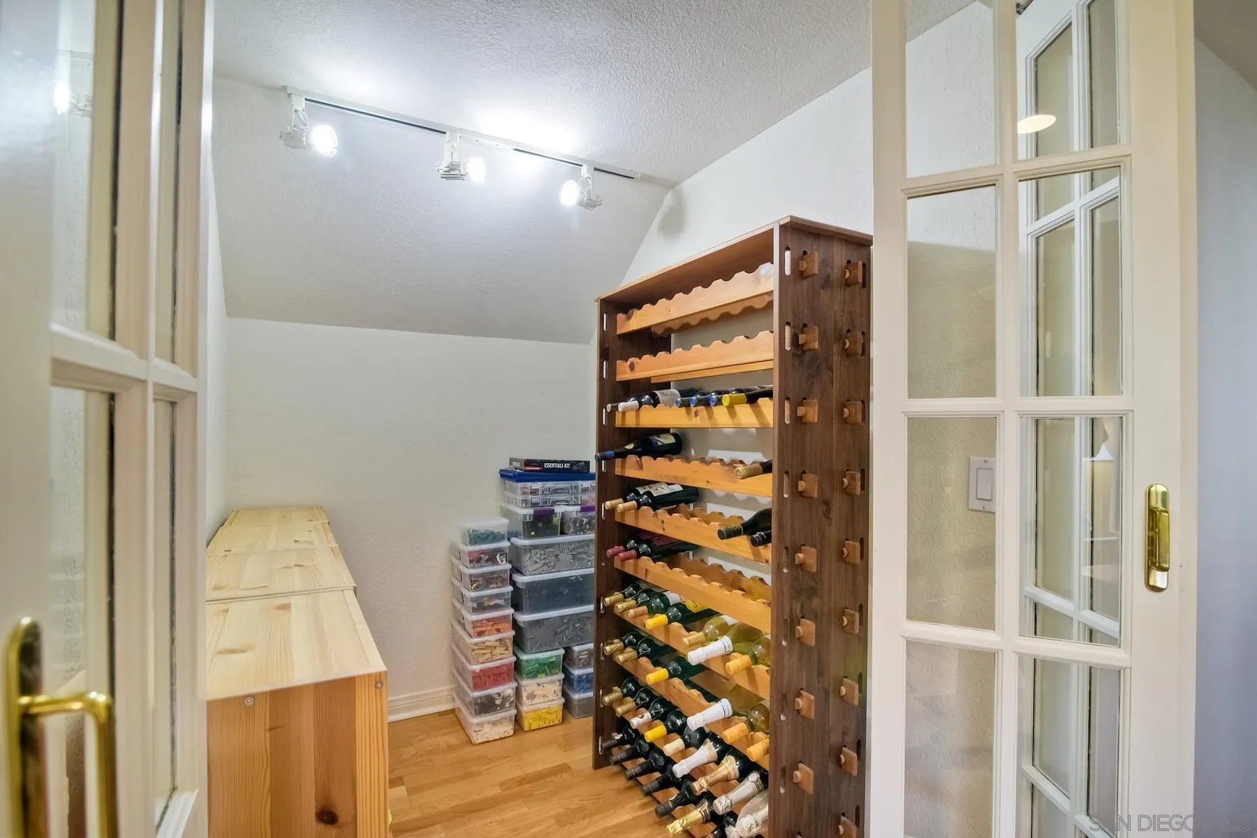 14859 Derringer Road Poway, CA 92064 - Photo 18 of 39 a view of walk in closet with clothes and shoes
