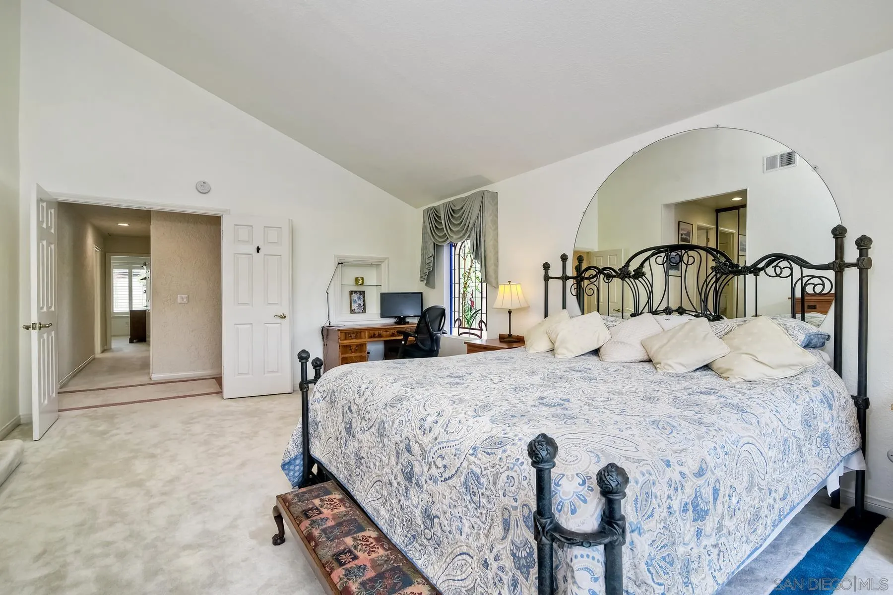 14859 Derringer Road Poway, CA 92064 - Photo 21 of 39 a bedroom with a bed and a mirror