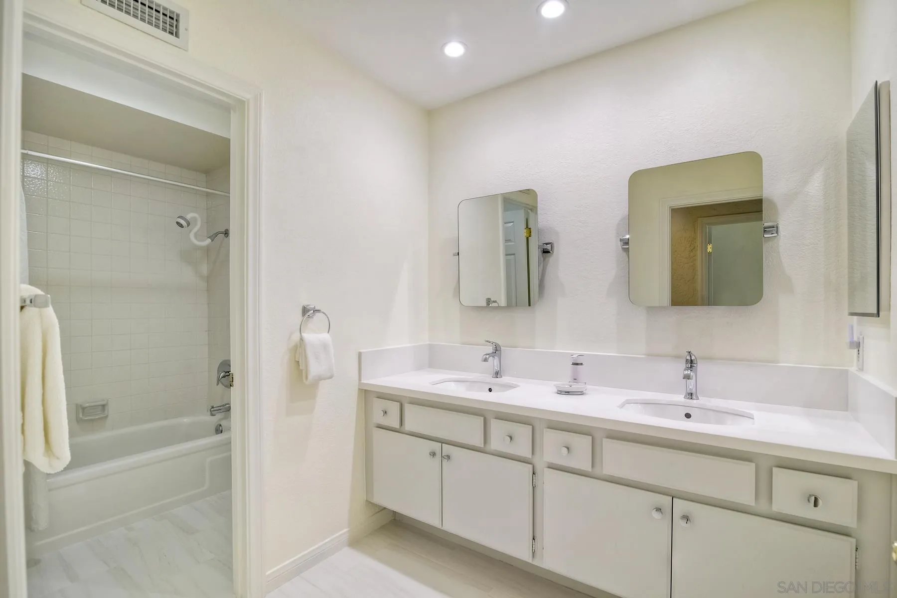 14859 Derringer Road Poway, CA 92064 - Photo 30 of 39 a spacious bathroom with a double vanity sink mirror and shower