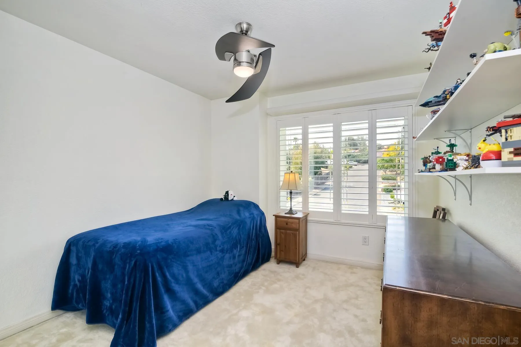 14859 Derringer Road Poway, CA 92064 - Photo 32 of 39 a bedroom with a bed and a large window