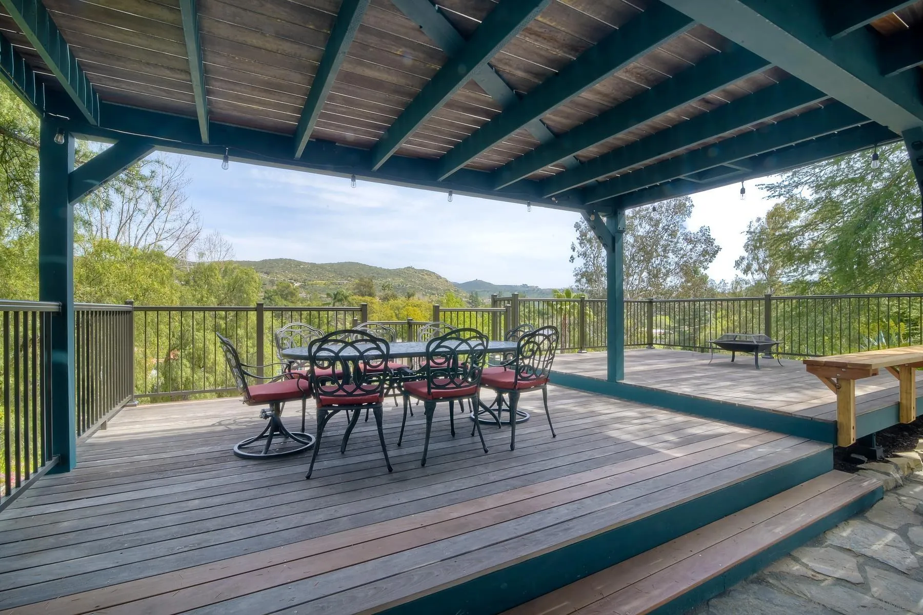 14859 Derringer Road Poway, CA 92064 - Photo 34 of 39 a view of a deck with chairs and wooden floor next to a yard