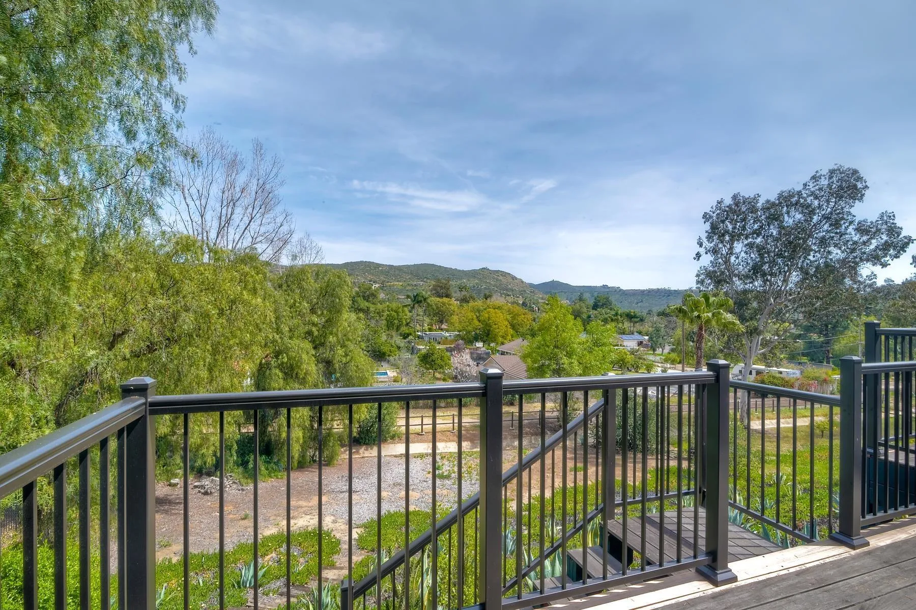 14859 Derringer Road Poway, CA 92064 - Photo 35 of 39 a view of a balcony with a pot